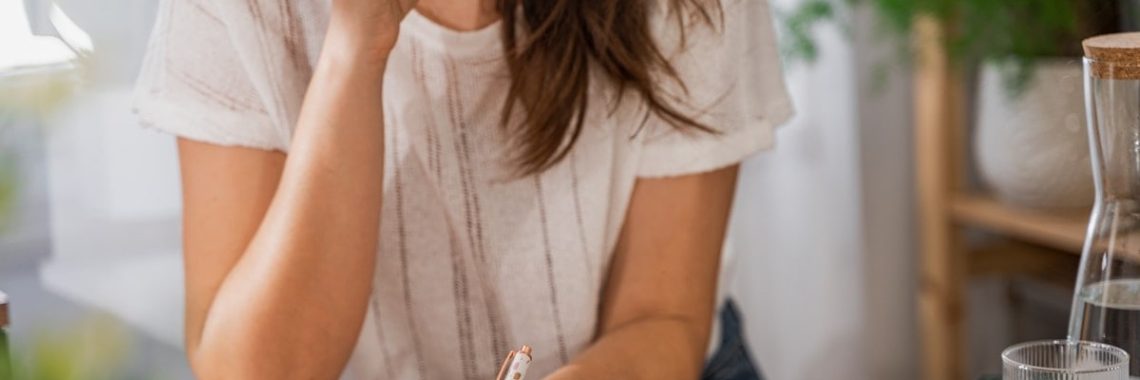 girl planing a week at home office in bright room
